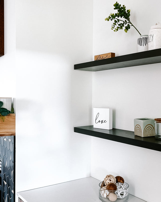 Black solid wood floating shelves