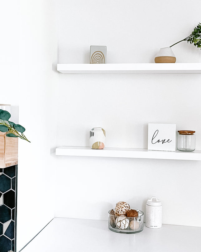 White solid wood floating shelves