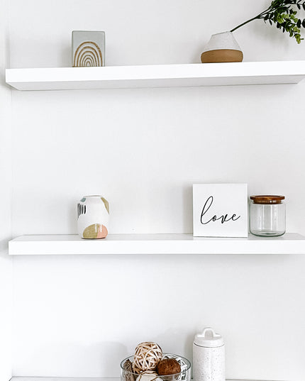 White solid wood floating shelves