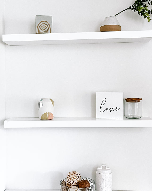 White solid wood floating shelves