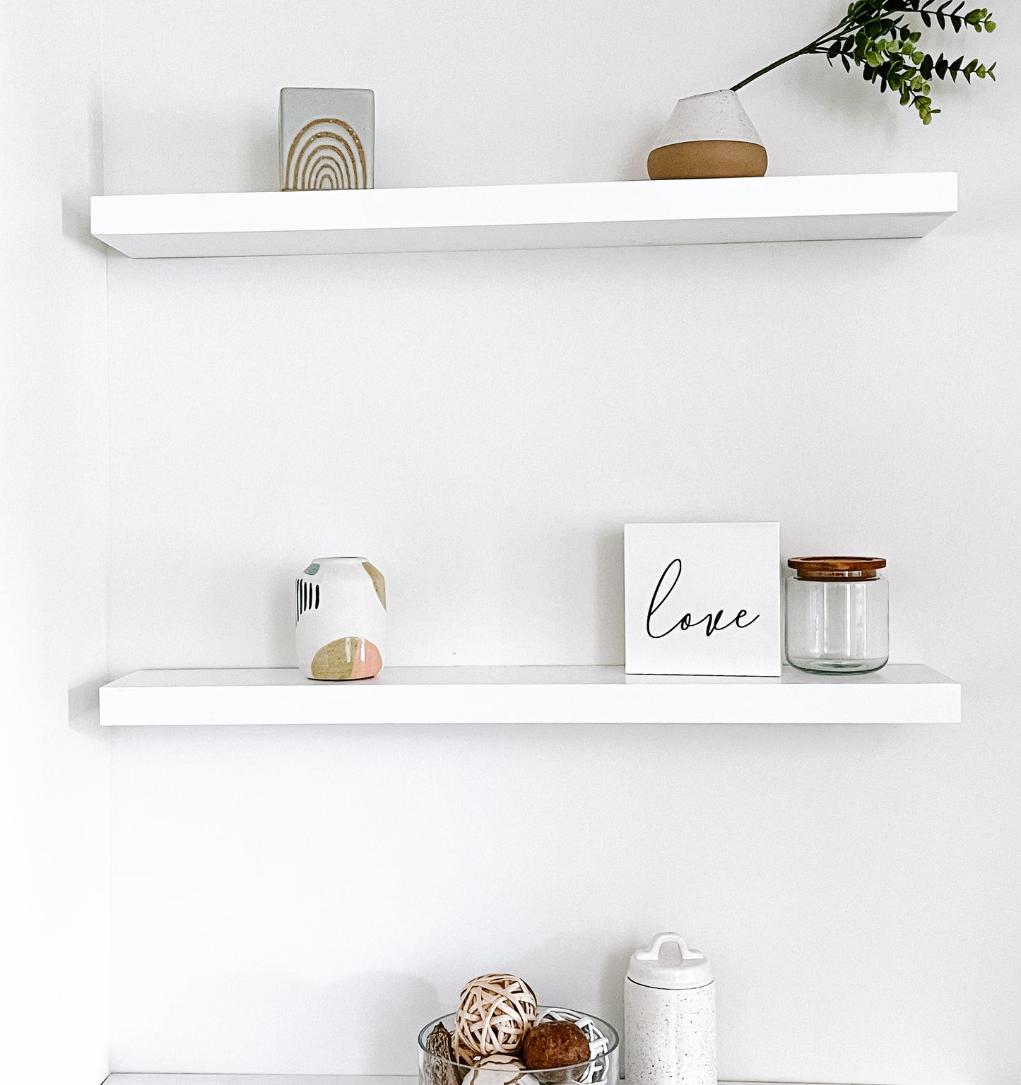 White solid wood floating shelves