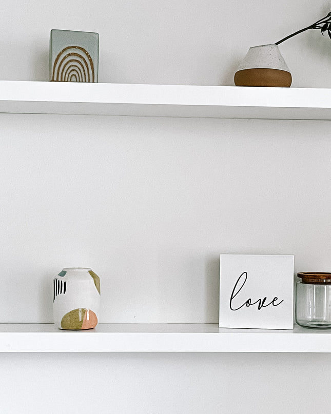 White solid wood floating shelves