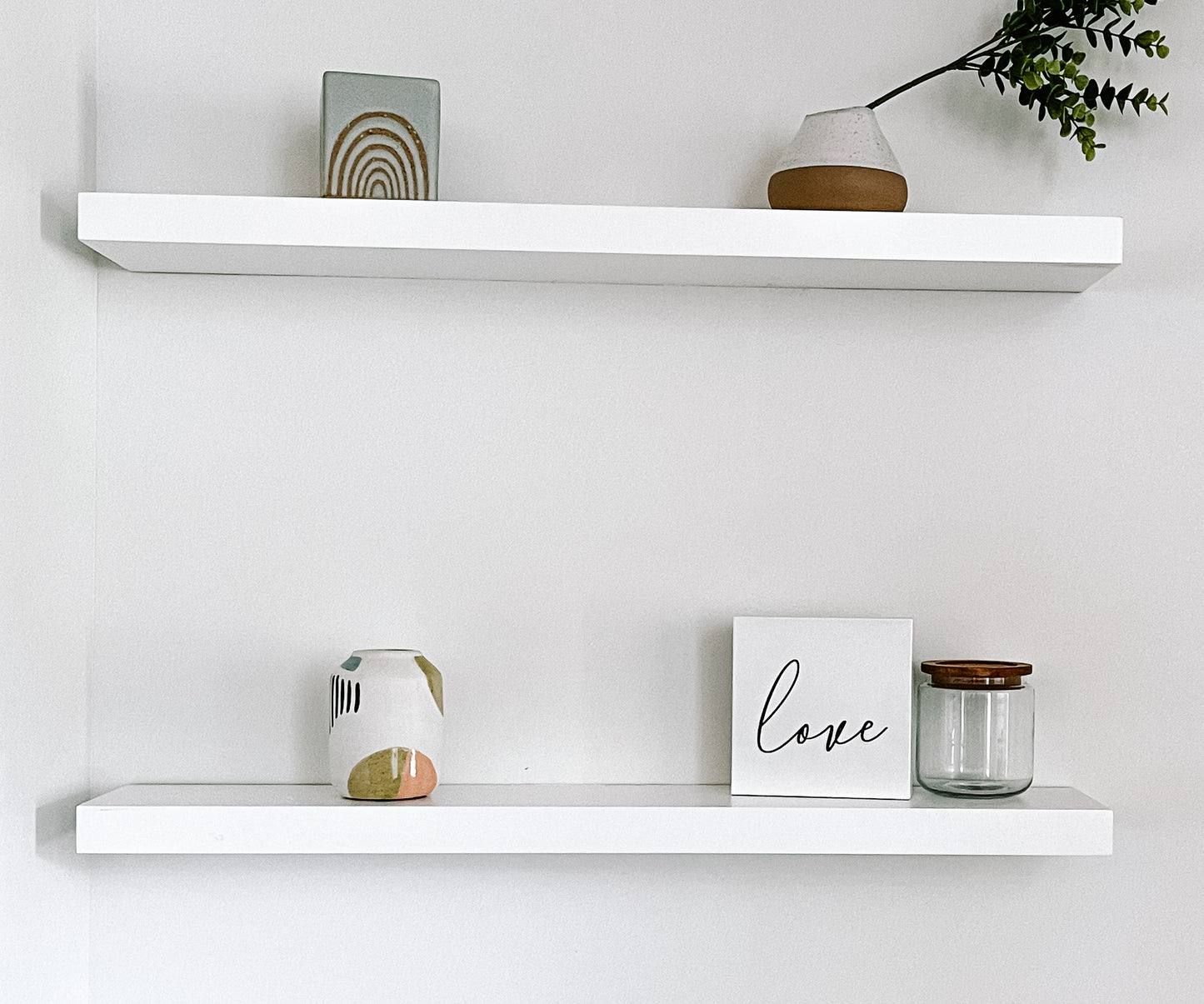 White solid wood floating shelves